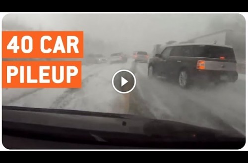 Driver Narrowly Misses Car Pile Up In Winter Storm