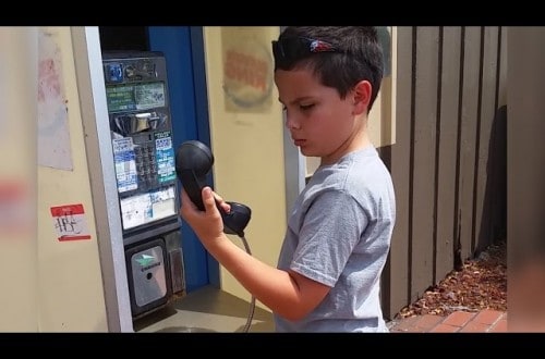 Kid Is Puzzled Seeing A Pay Phone For The First Time