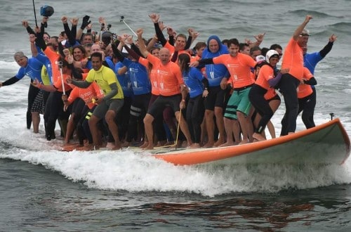 World Record Set When 66 People Ride One Surfboard At The Same Time