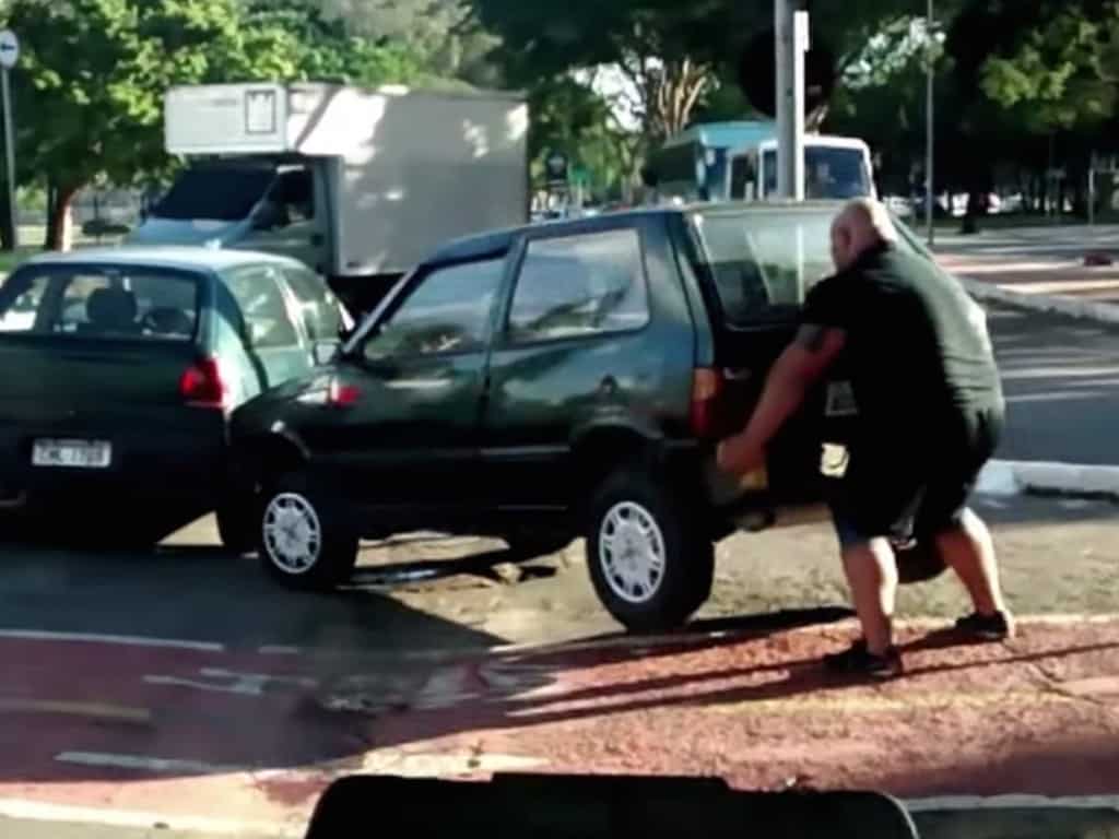 Crazy Strong Brazilian Cyclist Lifts Car Out Of Bike Lane