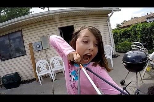 Watch This Little Girl Use a Slingbow to Pull Out a Loose Tooth