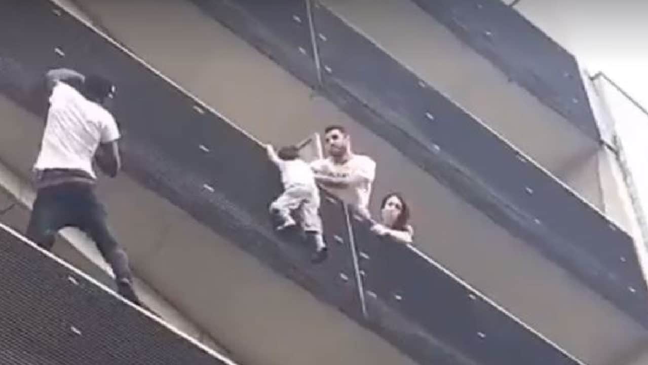 Man Climbs Up 4 Stories To Save Child Hanging From Balcony