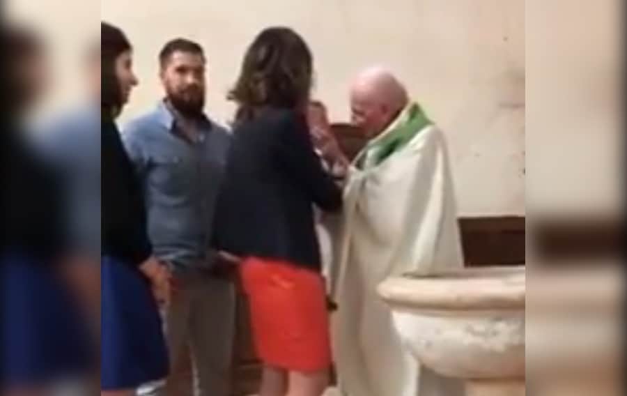 Shocking Video Of A Priest Slapping A Baby During Baptism